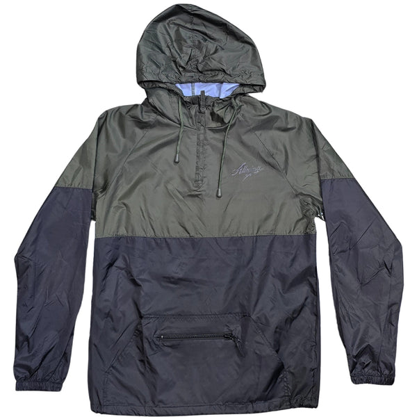 Allegiance Beta Windbreaker in black and green two-tone design with half-zip front, adjustable hood, and chest script logo.